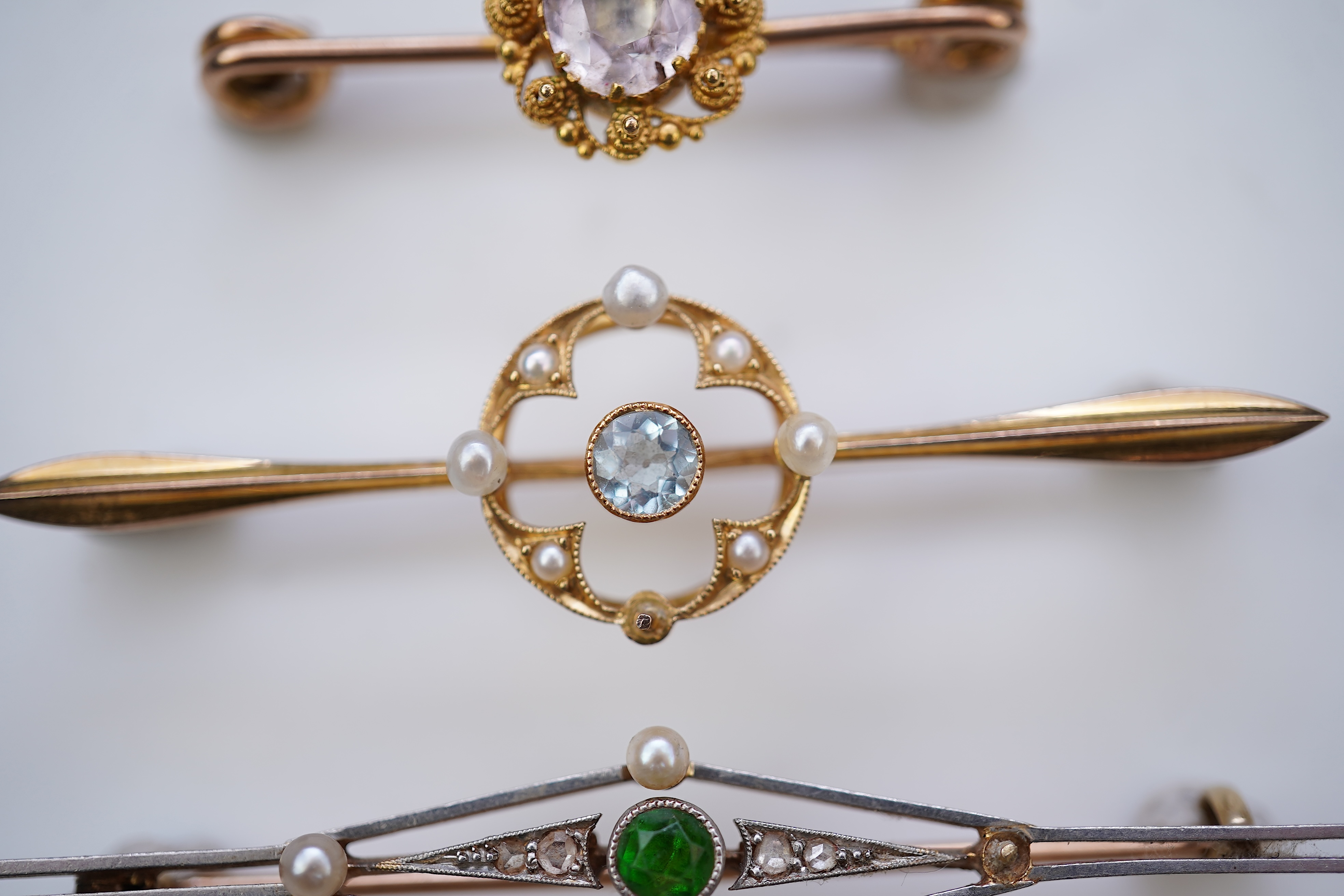 Four gold and gem-set bar brooches, early 20th century